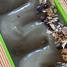 Load image into Gallery viewer, An over head view of freshly pour gray soap batter, which is scented with eucalyptus essential oil and a little bit of activated charcoal for color.
