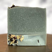 Load image into Gallery viewer, Two bars of eucalyptus bar soap, one laying flat with the top facing the viewer.  The other bar sits on top of the first, with the widest surface area facing the viewer to show the soft light gray color of the soap.  This soap is scented with all natural eucalyptus essential oil and colored with a touch of activated charcoal. 
